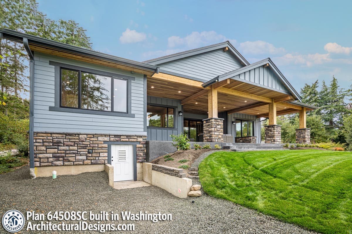 House plan exterior: Modern style with stone accents, wide covered entry, gabled rooflines, and multiple stories.