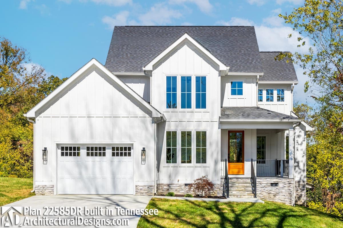 Modern Farmhouse style house plan exterior with a two-car garage, prominent gables, and covered front porch.