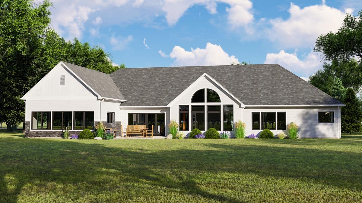 House plan exterior: Ranch style, one story, featuring a gable end, large arched window, and stone skirting.