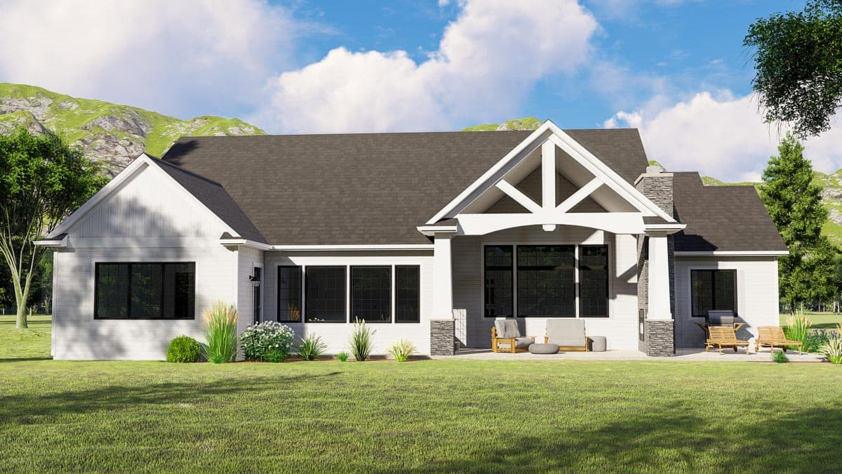House plan exterior: Modern Farmhouse style, single-story with gabled roof, covered porch with exposed beams, and stone chimney.
