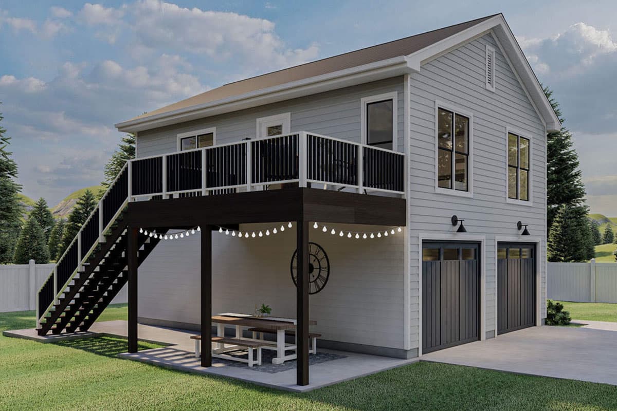 Two-story house plan exterior with a deck, gabled roof, and two-car garage. Exterior features include a staircase to the deck.