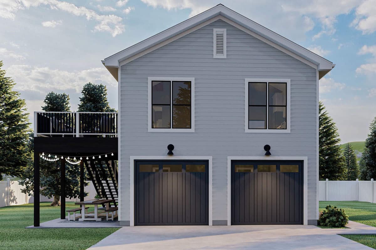 House plan exterior: Two-story structure with a side deck, two garage doors, and upper-level windows.