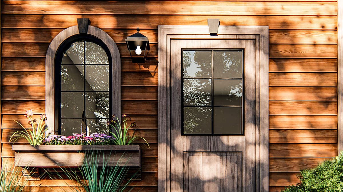 House plan exterior with arched window, door, and wood siding. Includes window box.