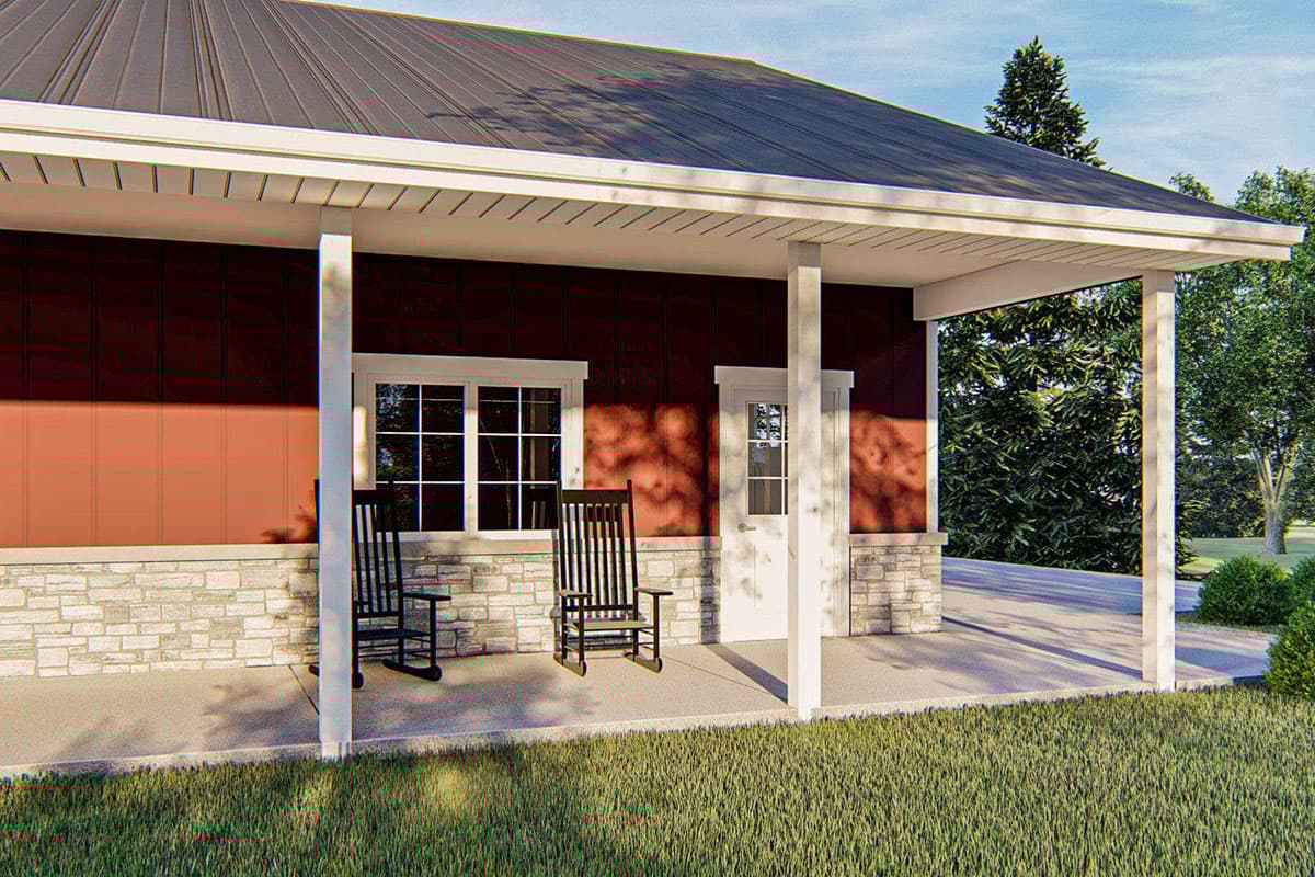 House plan exterior with stone foundation, two windows, and a covered porch with white columns and a metal roof.