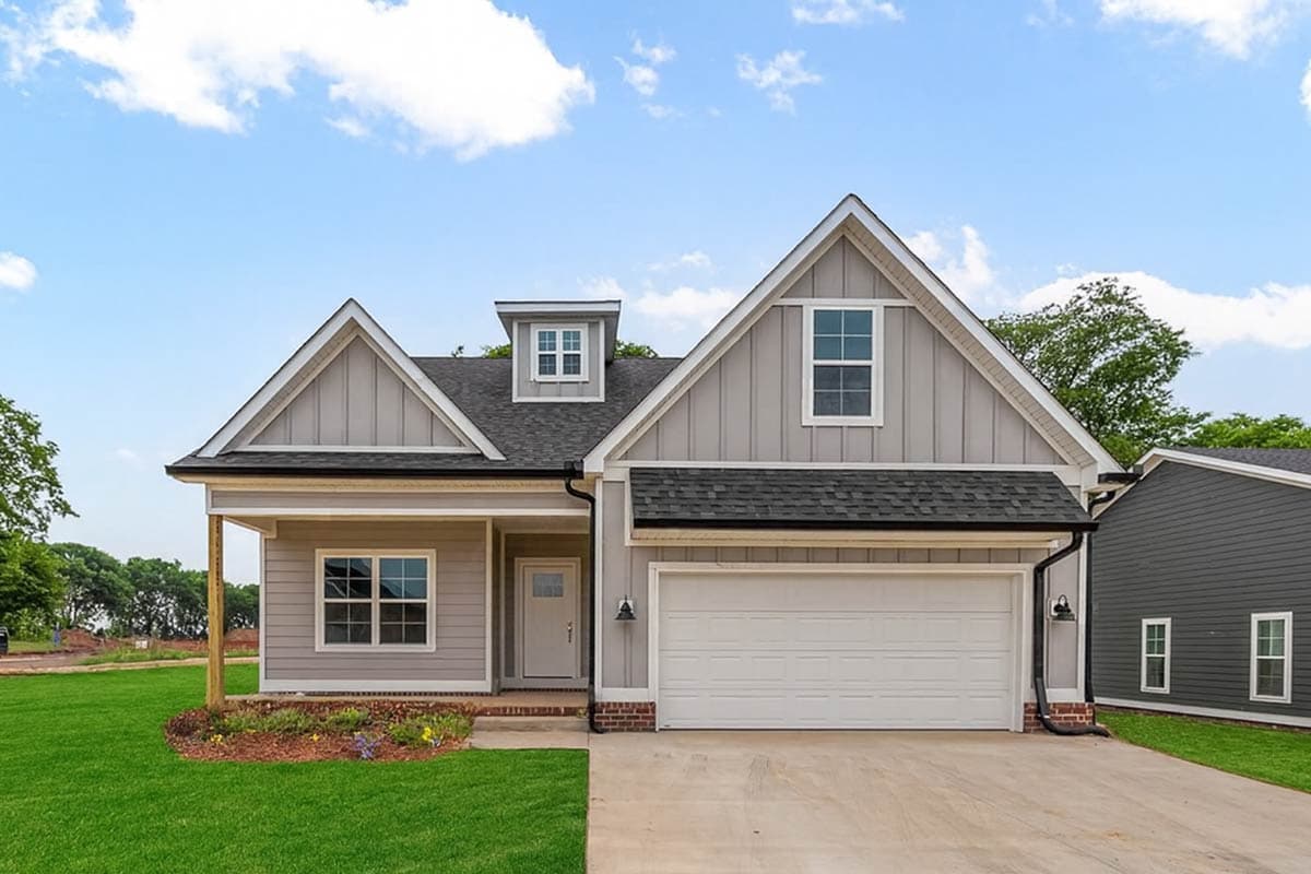 Modern Farmhouse house plan exterior with a dormer, gables, covered porch, and a two-car garage.