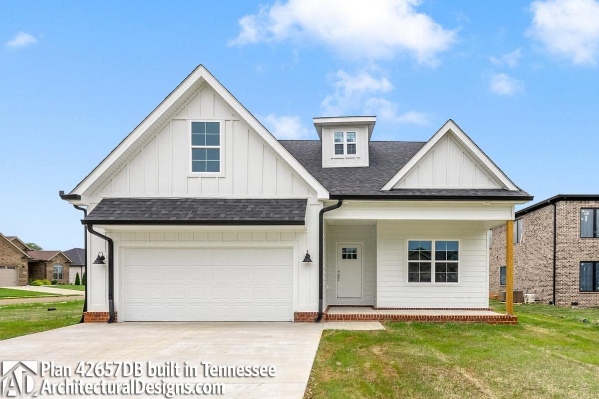 Modern Farmhouse house plan exterior with gables, dormer, covered porch, and attached garage.