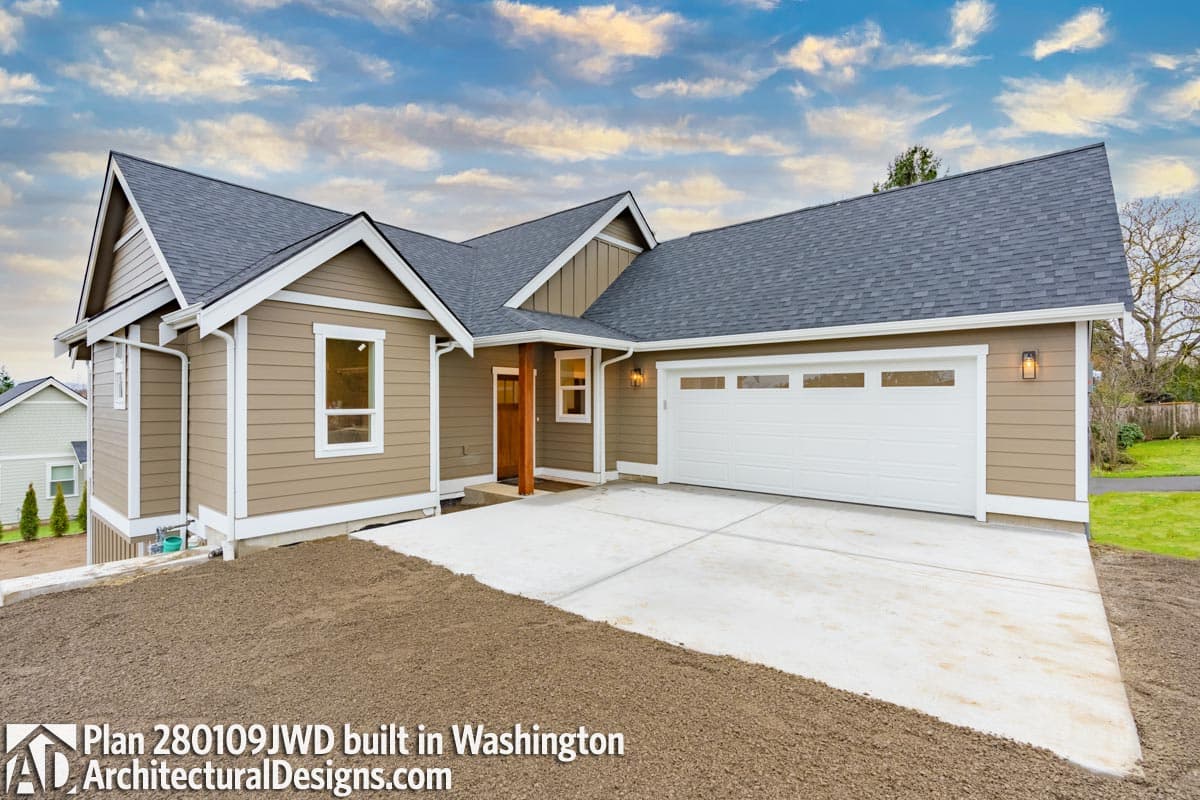 House plan exterior: Single-story Modern Farmhouse with attached two-car garage, prominent gables, and covered entry.