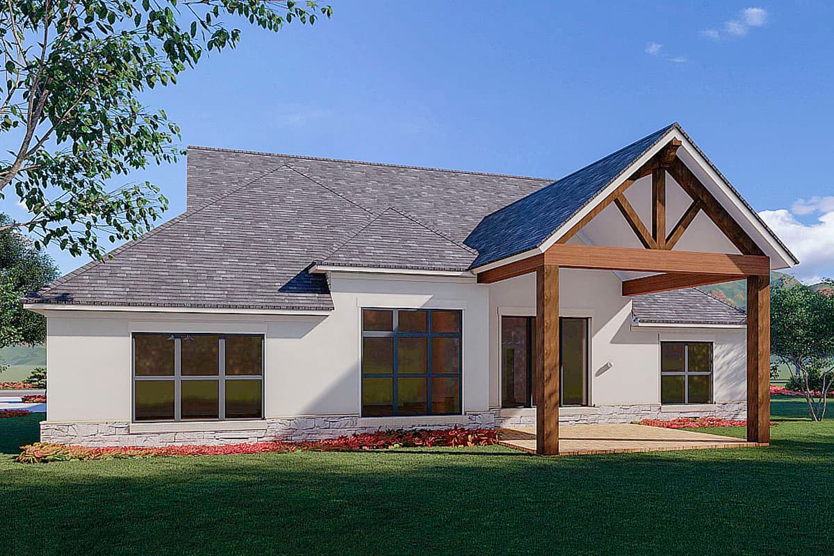 House plan exterior view: Single-story modern design with stone base, gabled roof, and exposed wood beams on covered patio.