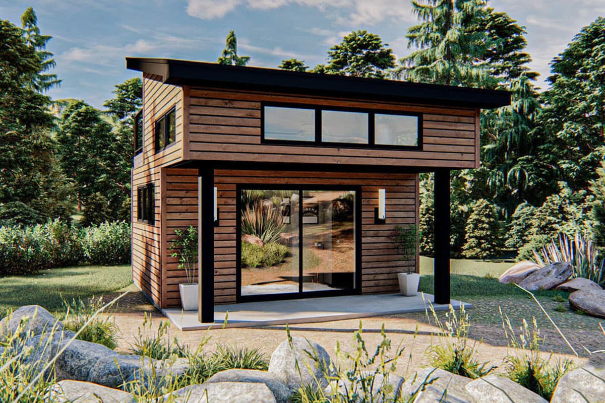 House plan exterior. Two-story modern design with horizontal wood siding. Features a flat roof, overhanging entry, and large sliding glass doors.