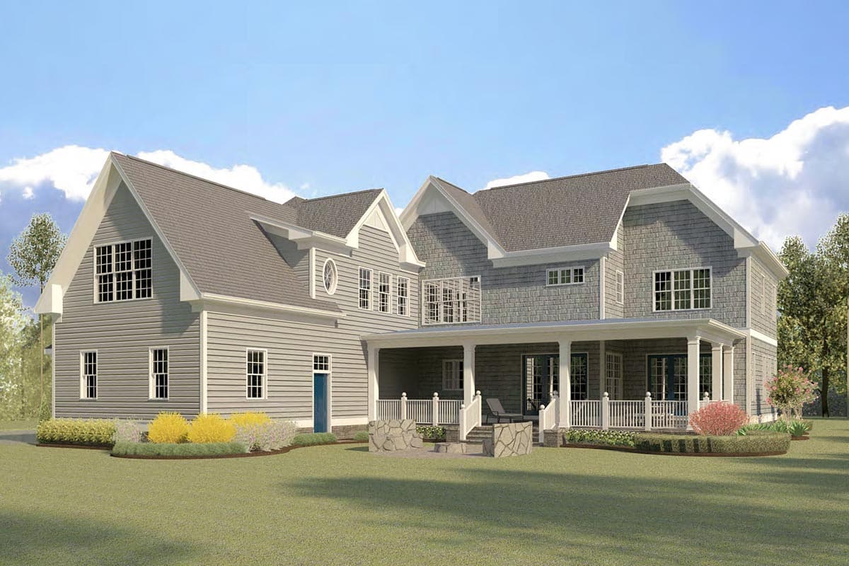 House plan exterior, two stories, grey siding, gabled dormers, large wrap-around porch with white railing, stone patio.