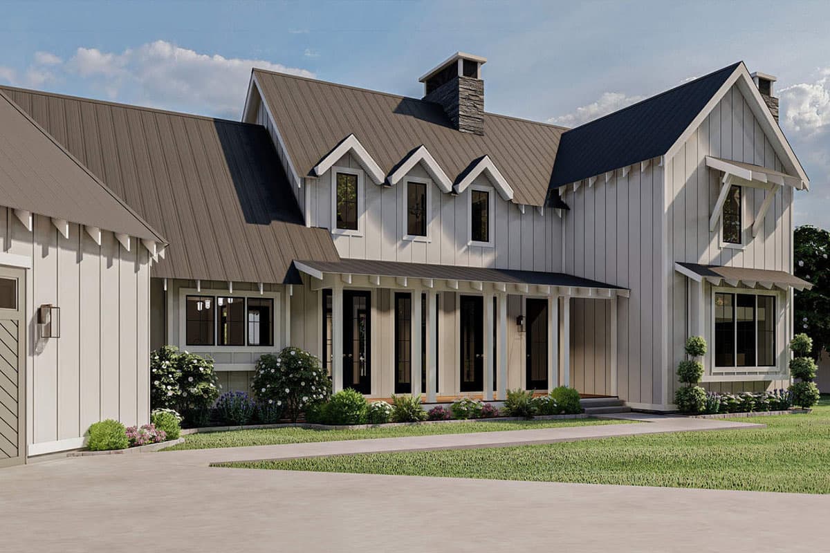 Modern Farmhouse house plan exterior with metal roof, multiple gables, dormers, stone chimney, and covered front porch.