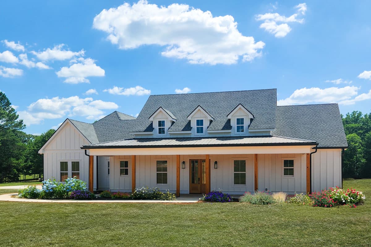 Modern Farmhouse house plan exterior with a wraparound porch, board and batten siding, and three dormer windows.