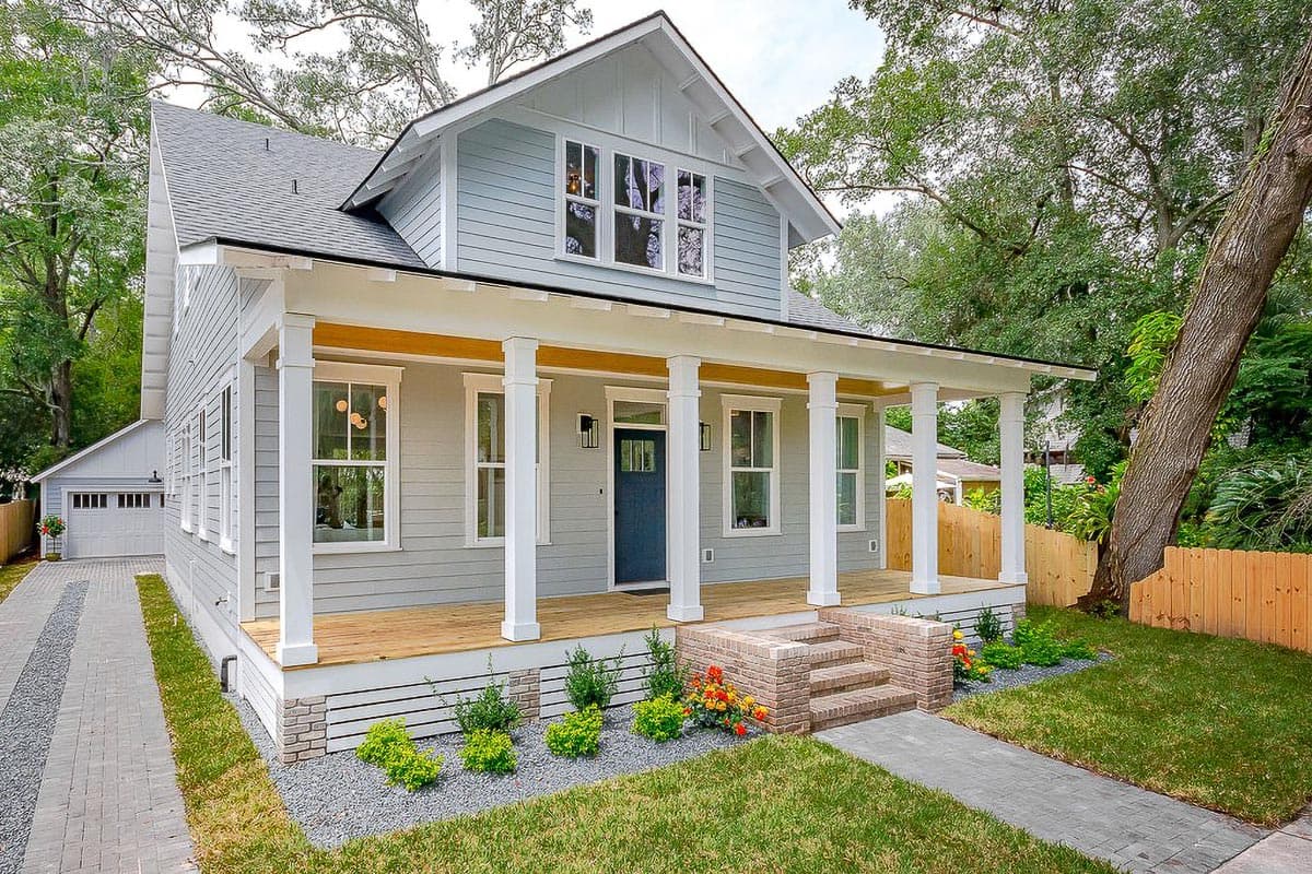 House plan exterior view of a two-story Craftsman home with a front porch, gables, and a prominent roofline.