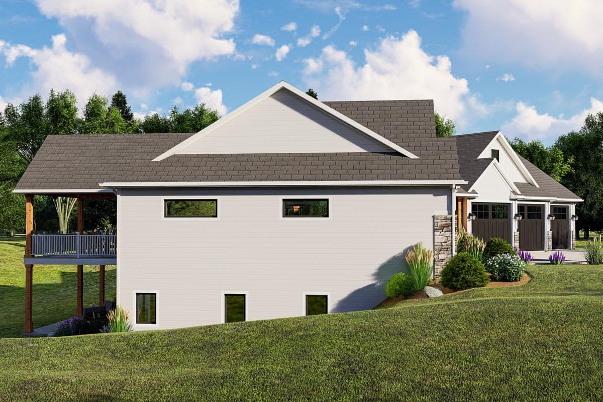 House plan exterior featuring a gabled roof, stone accents, covered deck, and a three-car garage.