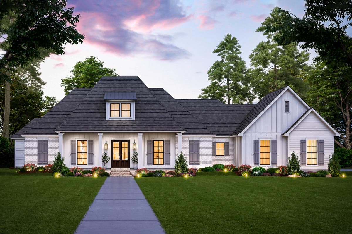 House plan exterior. Modern farmhouse style. Single-story with a gabled roof and dormer. Features a covered front porch and brick facade.