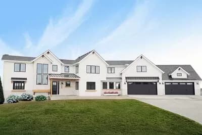 Multi-gabled Modern Farmhouse Plan with Angled 4-car Garage and School Room