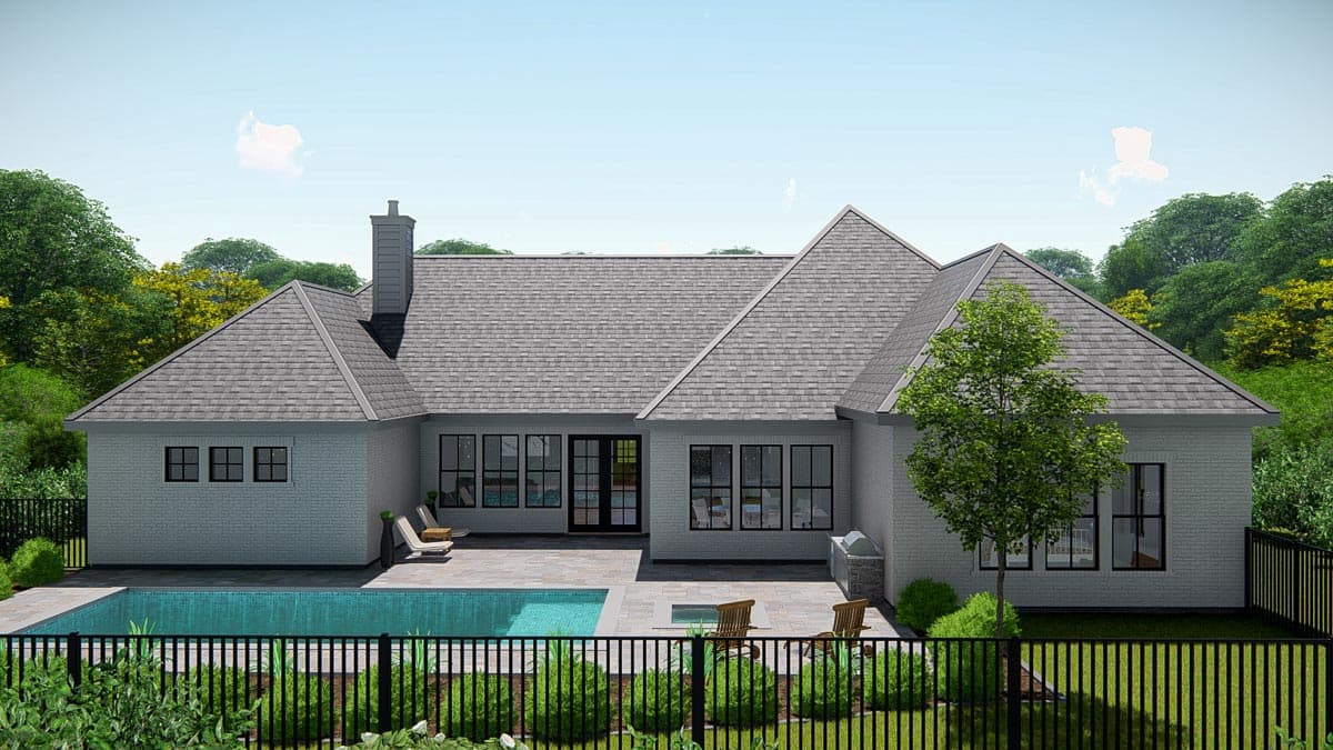 House plan exterior: single-story, white brick, various gabled rooflines, chimney, and expansive rear patio with pool.