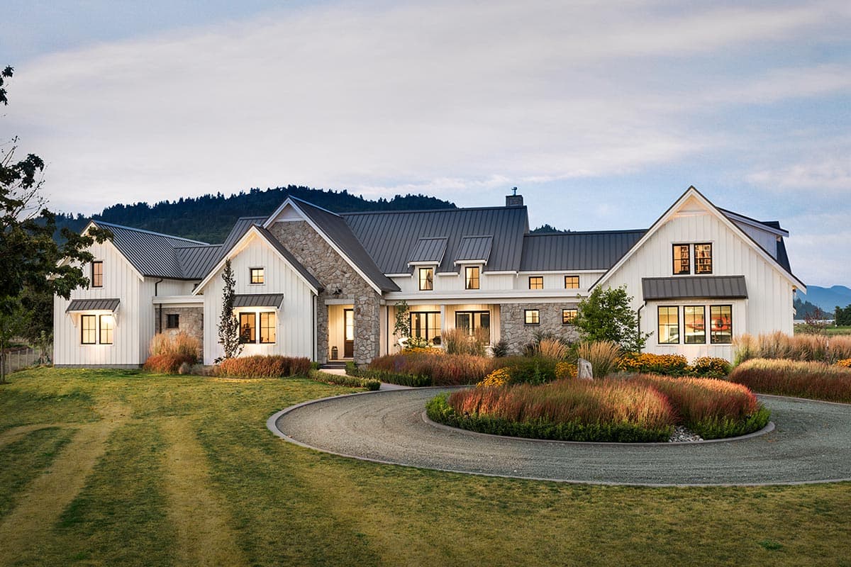 House plan exterior. Modern Farmhouse style with a two-story layout, board-and-batten siding, multiple gables, and a metal roof.