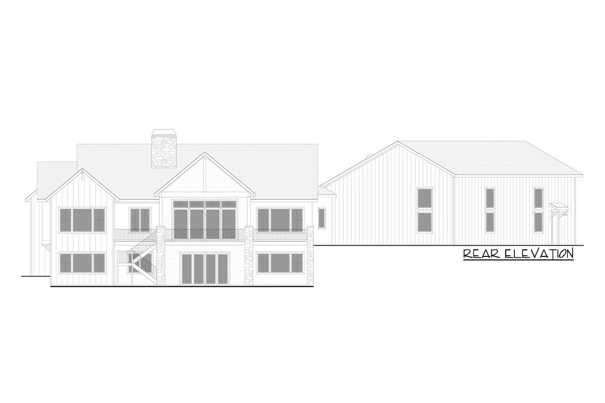 Rear elevation drawing of a multi-story house plan featuring gables, a stone chimney, balconies, and diverse window styles.