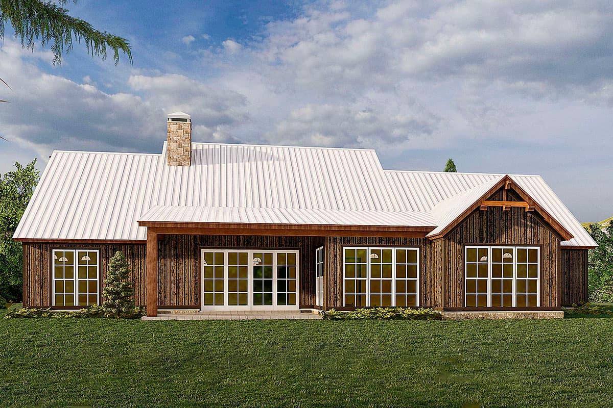 House plan exterior of a single-story Modern Farmhouse with a white metal roof, stone chimney, large windows, and a covered porch.