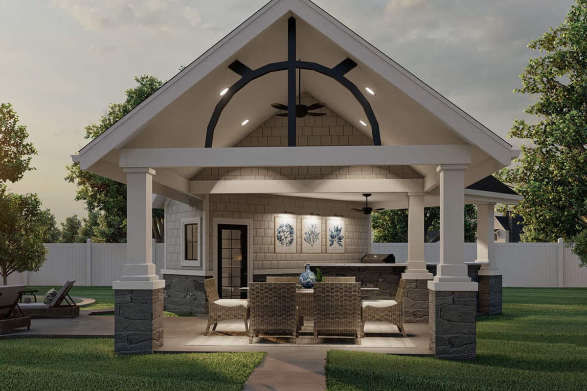 House plan exterior: Covered outdoor living space with dining area, kitchen counter, and vaulted ceiling with exposed beams.