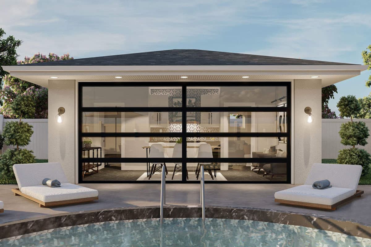 House plan exterior with glass panel garage door, patio with lounge chairs, and an adjacent pool.