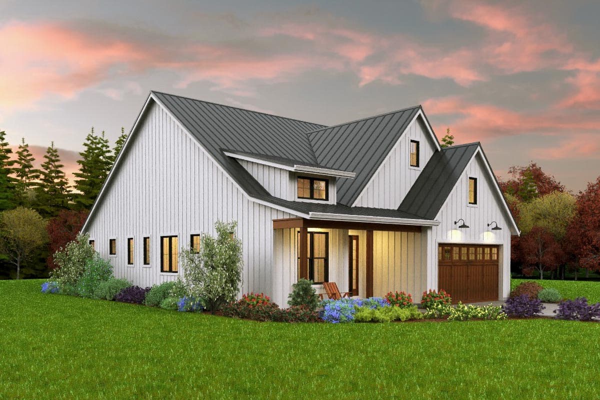 Modern Farmhouse house plan exterior with a metal roof, gabled dormers, covered porch, and detached garage.