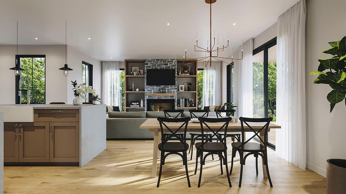 Open-concept living space with kitchen island, dining area, and living room featuring stone fireplace and built-in shelving.