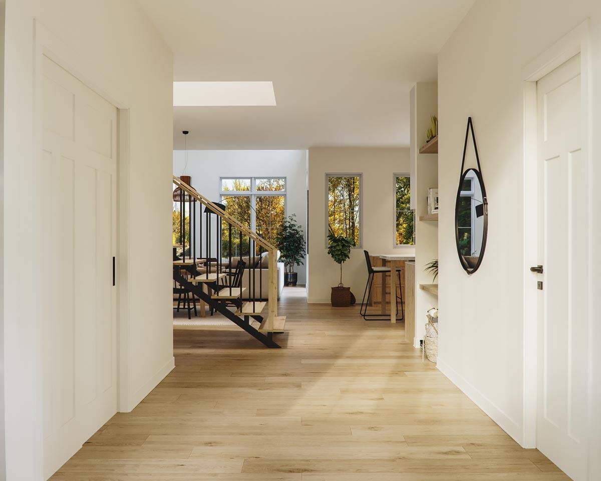 Interior view: Open hallway with a modern staircase, skylight, and view into dining area and kitchen.