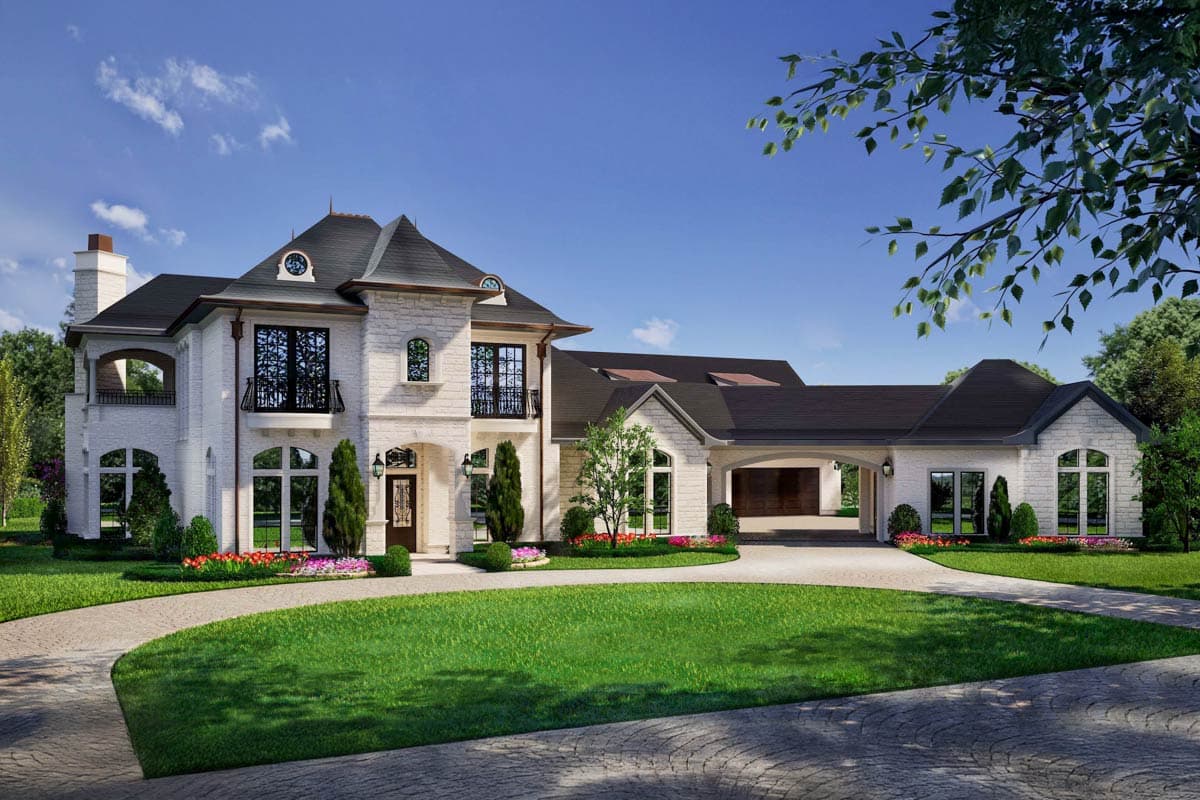 House plan exterior. Two-story home in a French-inspired style with dormers, eyebrow windows, a porte-cochère, and a steeply pitched roofline.