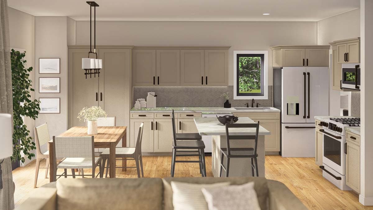 Kitchen and dining area with island, wood dining table, cabinets, refrigerator, and gas range.