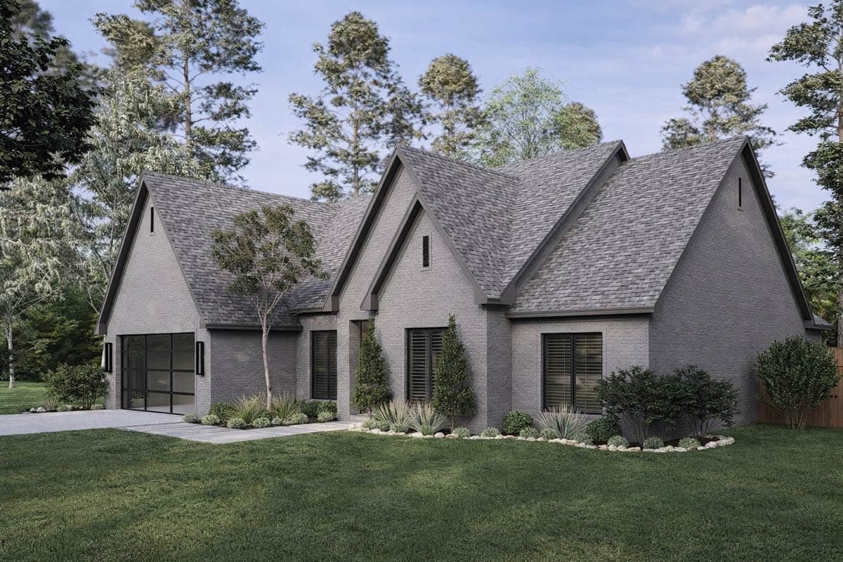 House plan exterior with gray brick, multiple gables, and a modern glass garage door.