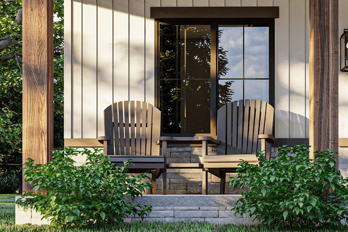House plan exterior featuring a covered porch with wood columns, vertical siding, and a large window.