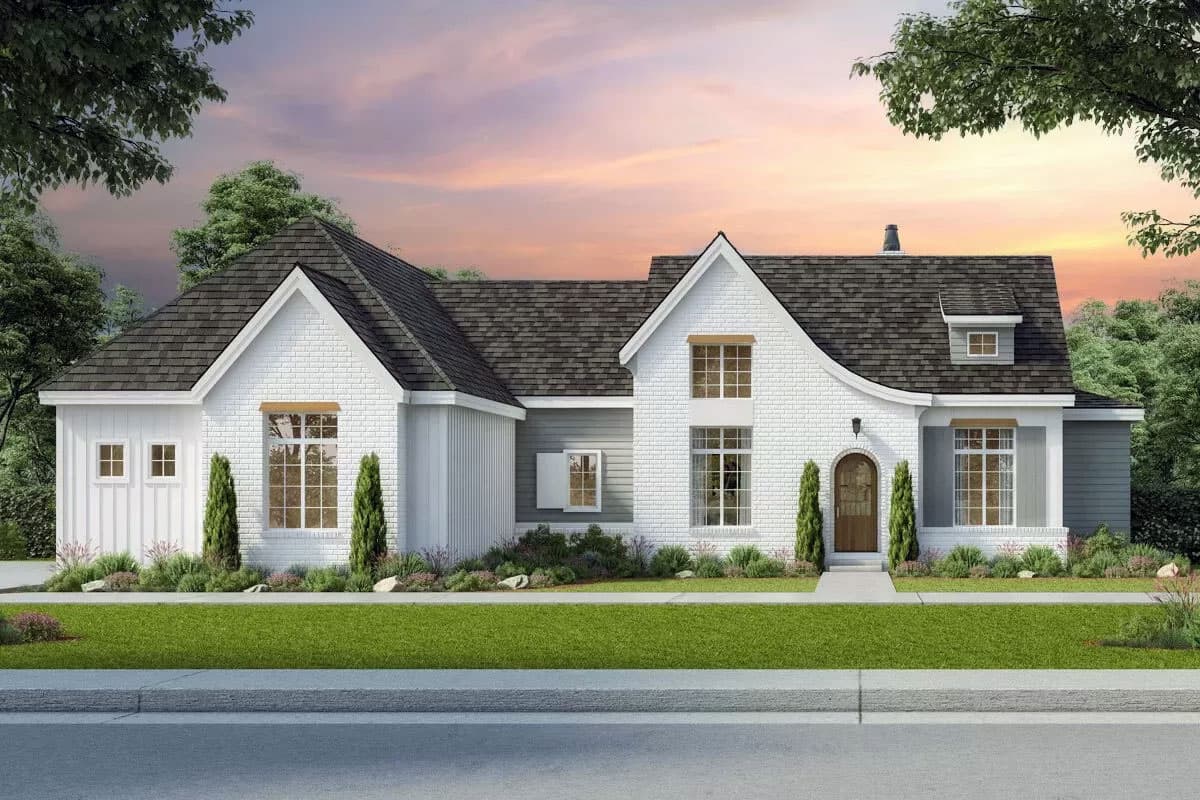 House plan exterior. A two-story farmhouse style with a gabled roof, arched entry, and dormer. Features brick and shiplap siding.