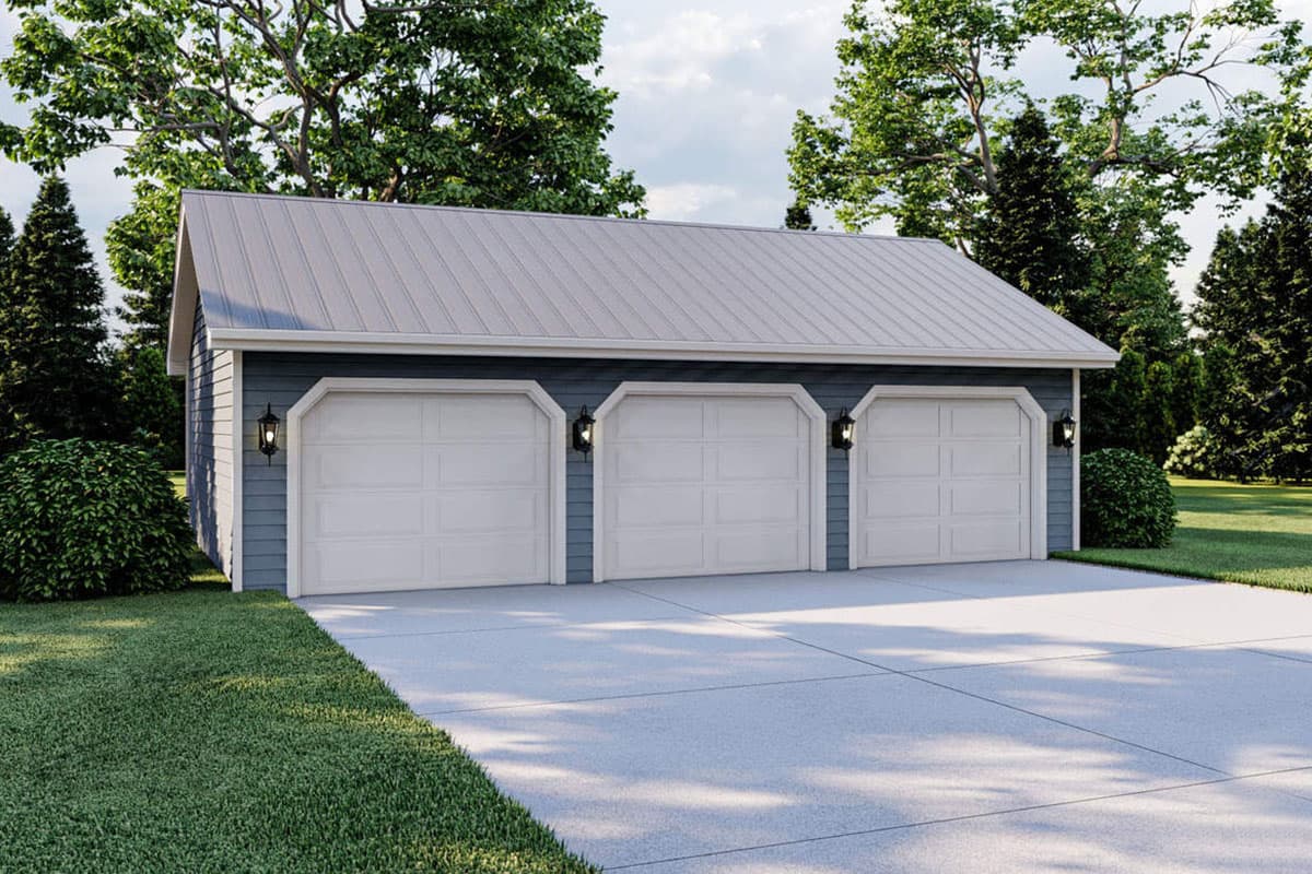 House plan exterior with three-car garage, metal roof, and wall-mounted exterior lights. Gable roof style and concrete driveway.