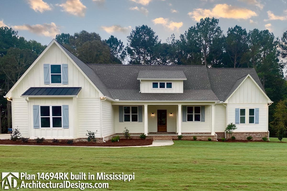 Modern Farmhouse house plan exterior with board-and-batten siding, prominent gable, and covered front porch with columns.