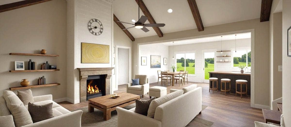 Spacious, modern living room with a fireplace, open kitchen, and dining area. The space features light-colored sofas, dark wooden beams, and expansive windows.