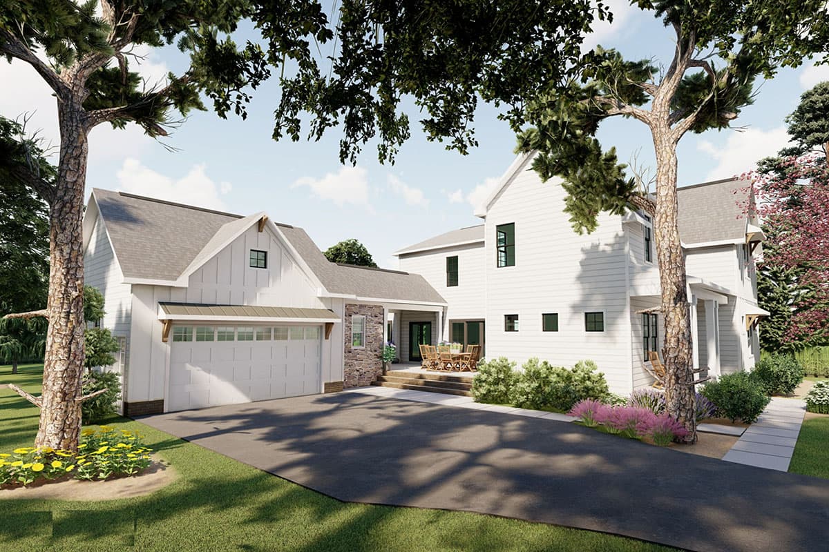 Modern Farmhouse house plan exterior with white board and batten siding, gabled roof, stone accents, and a two-car garage.