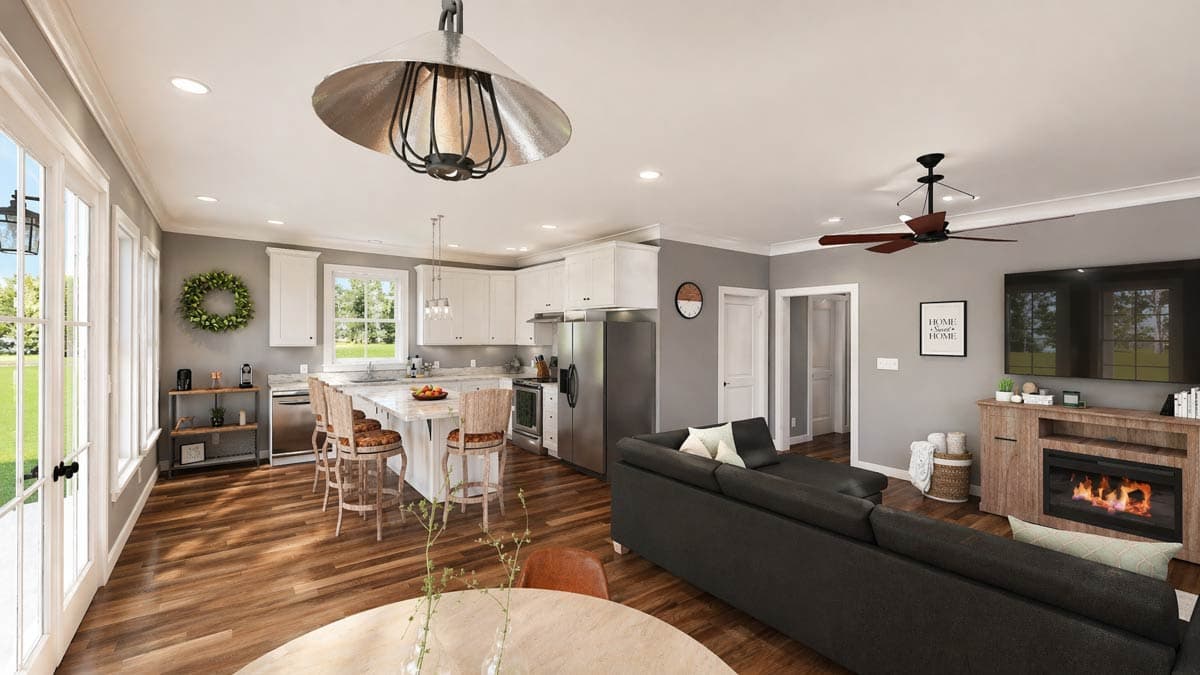 Open-concept living space with kitchen island, fireplace, and large windows. Modern farmhouse style.