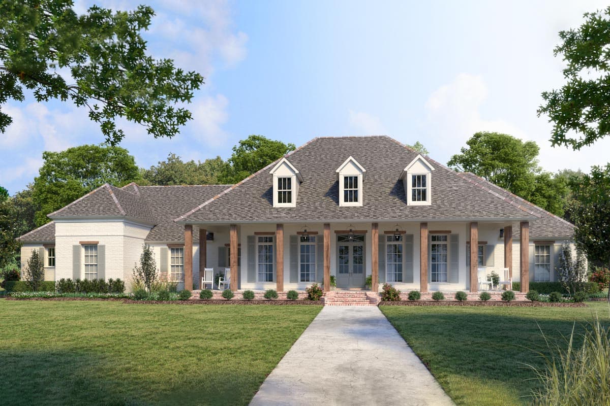 House plan exterior. One-story house in a farmhouse style with a large front porch, dormers, and a gabled roofline.