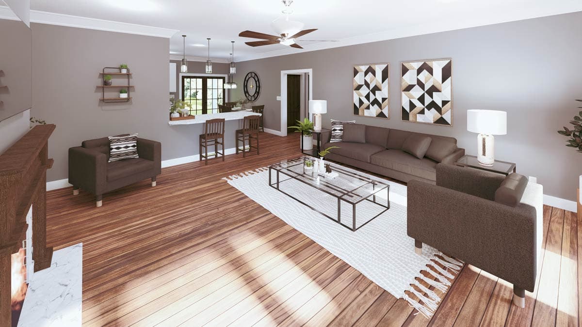 Open-concept living and dining area with a fireplace, island bar, seating, and hardwood floors.