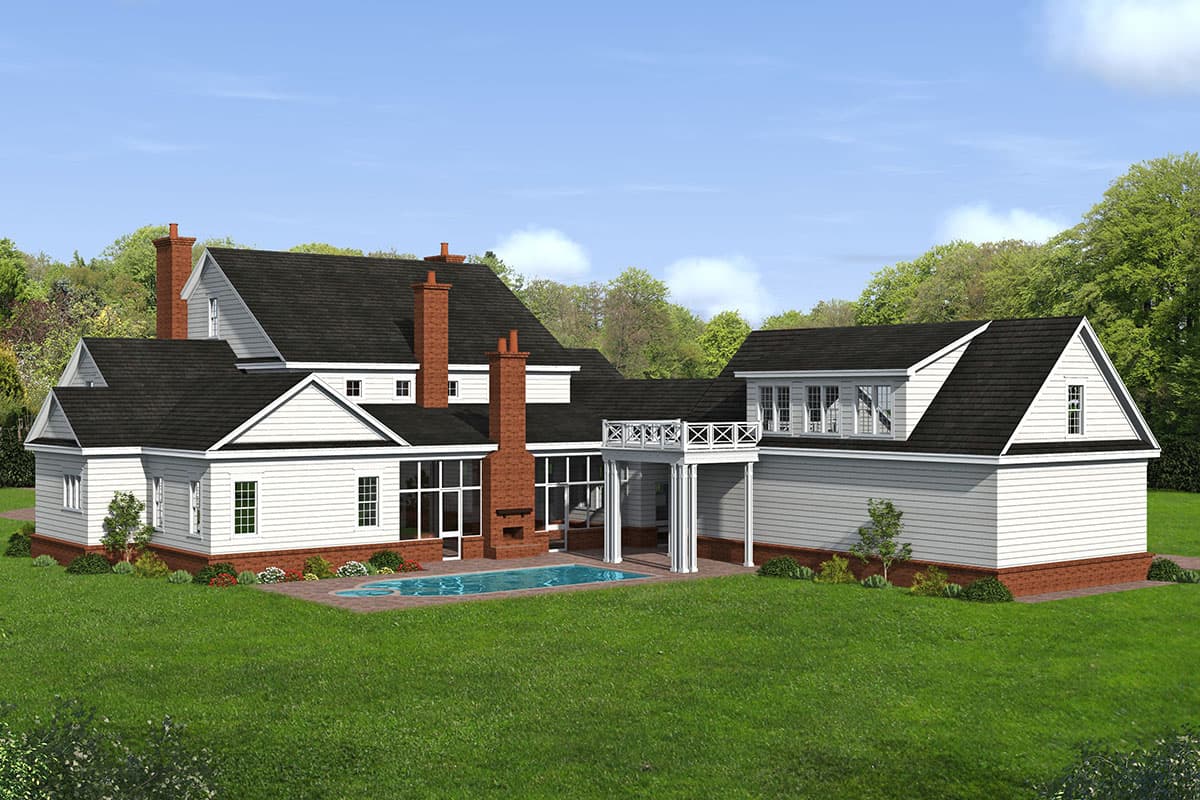 House plan exterior. Two-story home with dormers, brick chimneys, covered porch with columns, and a swimming pool.