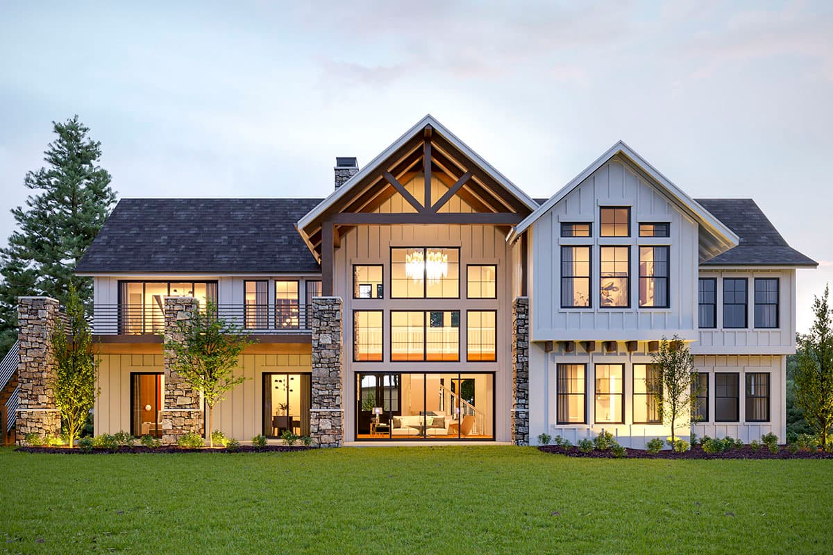 Modern Farmhouse house plan exterior with stone accents, gables, large windows, and balconies.