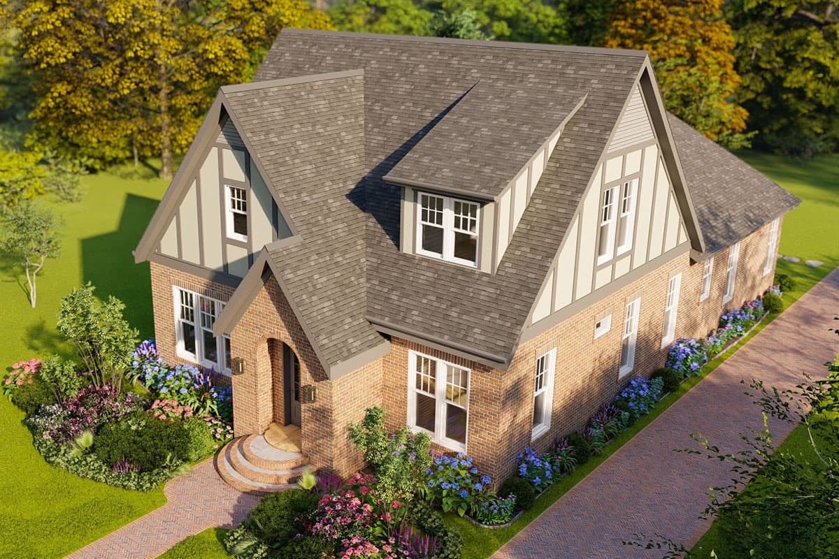 House plan exterior: Two-story brick home with Tudor-style accents, gables, dormer window, and arched entryway.