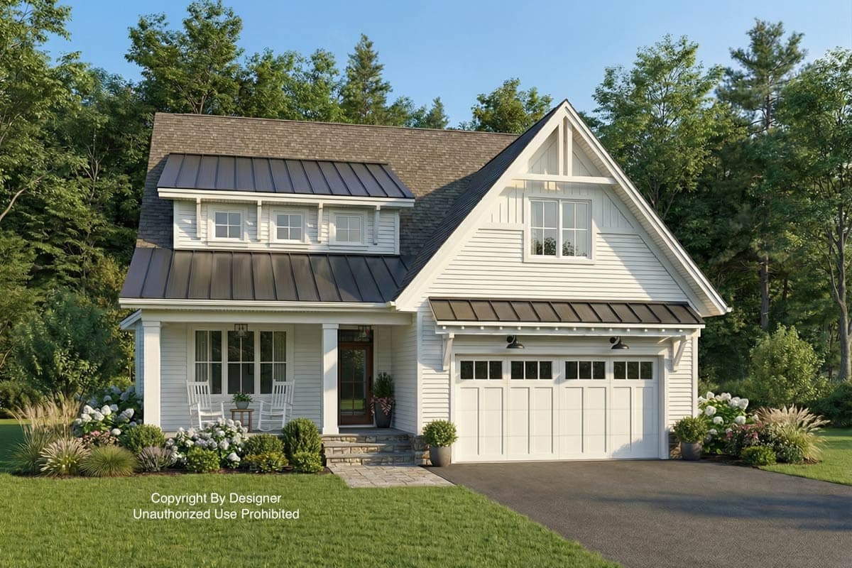 A charming white house with dark metal roofing, a front porch with rocking chairs, and a two-car garage set against lush green trees.