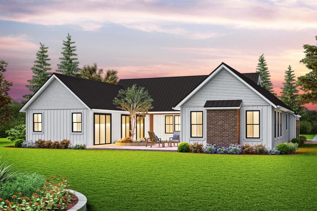 Modern Farmhouse house plan exterior with black metal roof, white siding, gables, and brick accents.