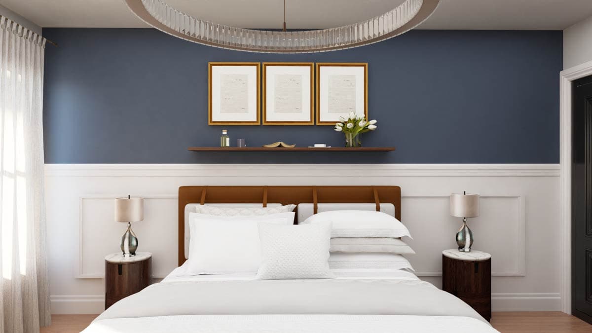 Bedroom interior with a bed, two nightstands, artwork on the wall, and a circular light fixture.