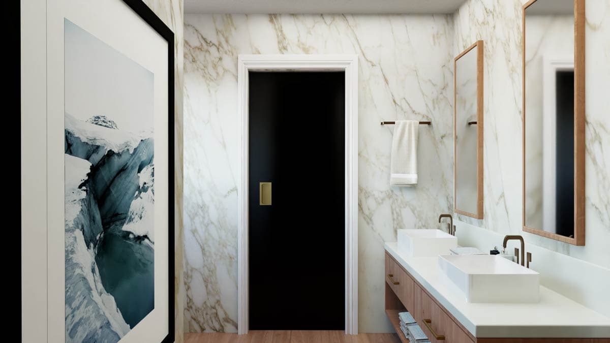 Bathroom interior with marble walls, double vanity with vessel sinks, and a black door.