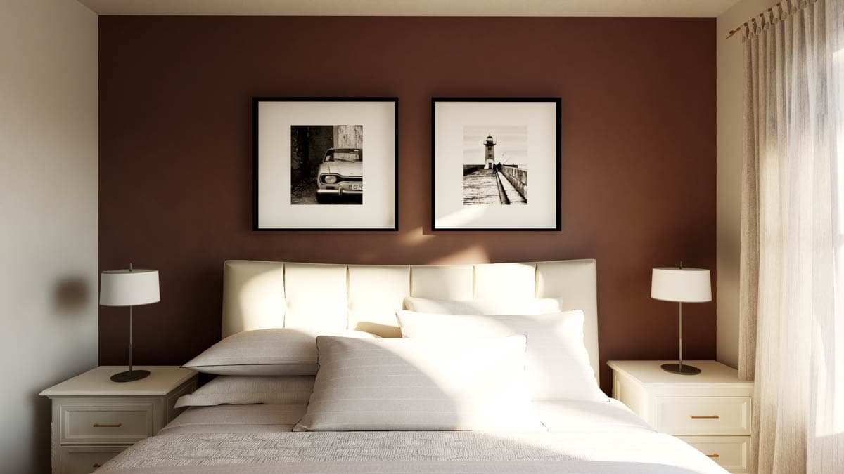 Bedroom rendering with white tufted headboard, two framed black and white art pieces, and bedside lamps.