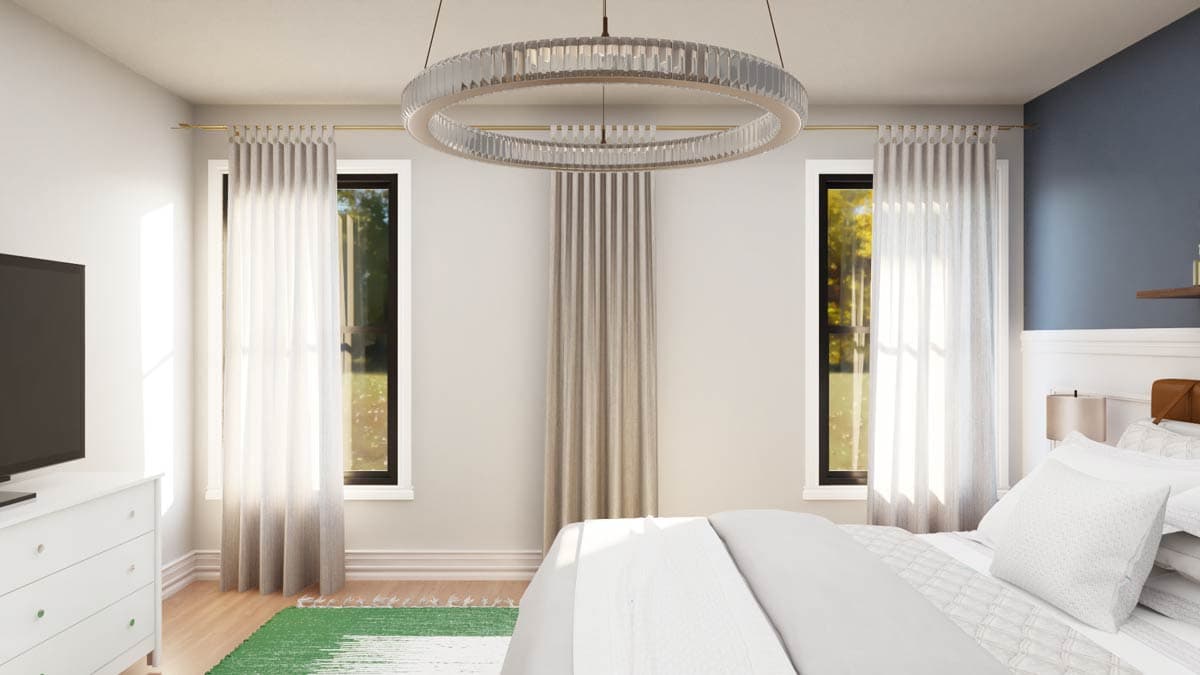 Bedroom interior with large windows, light drapes, a circular chandelier, and a king-size bed.
